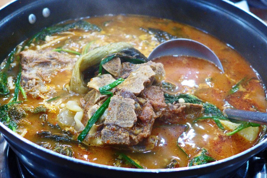 Gamjatang, Korean pork bone stew, in a shared pot