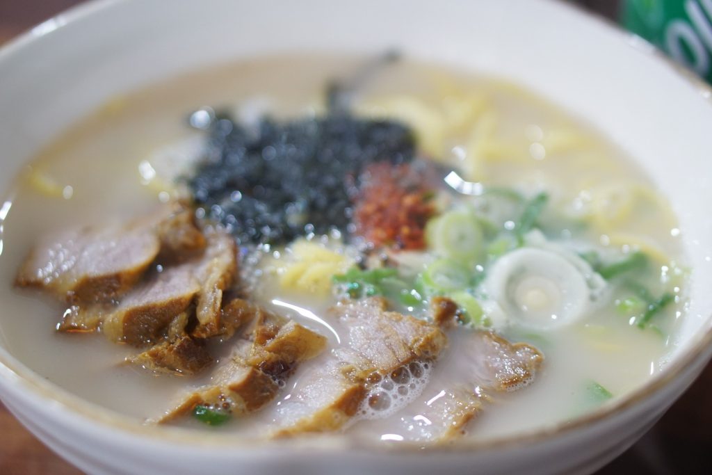 Jeju gogi-guksu, pork noodle soup in a milky broth