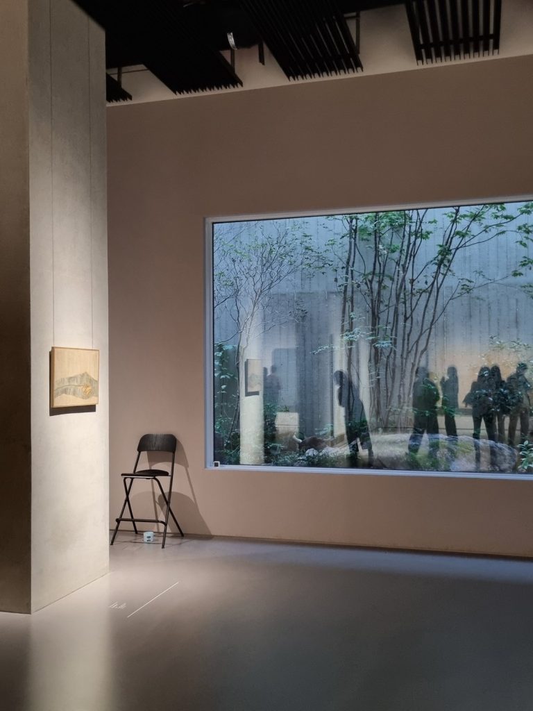 Gallery window looking onto a tree-filled courtyard garden at Park Seo-Bo Museum